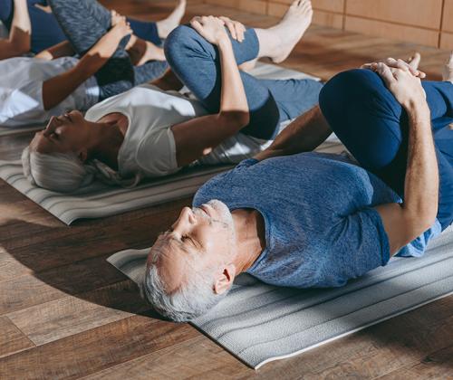 seniors stretching to relieve spinal stenosis pain